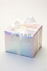 包裹丝带背景图片_用白色丝带包裹的长方形礼品盒