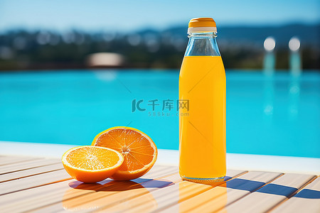 夏天橙背景图片_otz f040橙汁黄色玻璃瓶旁边的橙子