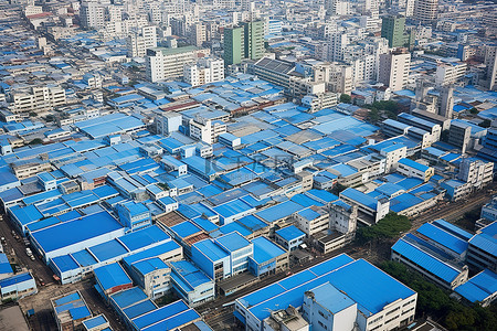 产业区背景图片_充满蓝色屋顶和工业建筑的城市的鸟瞰图