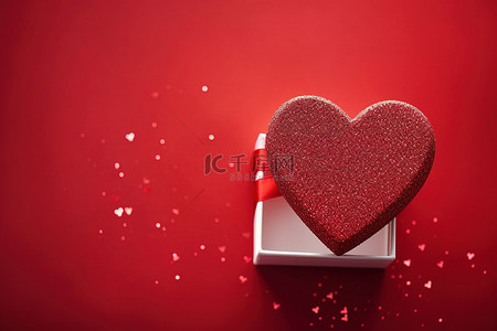 心形礼物背景图片_红色背景上的心形礼物盒