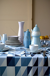 白色桌布背景图片_一张铺有蓝色和白色桌布的桌子