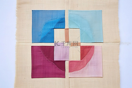 一块麻布背景图片_一块大布上用布制成的四个彩色方块