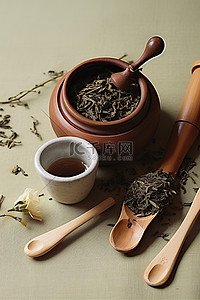 茶叶背景图片_一个装有茶叶和勺子的壶
