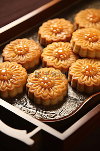 烤盘手绘背景图片_烤盘上的中国香港甜饼干的图像