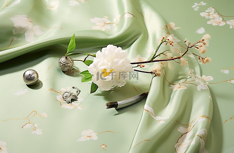 青瓷背景图片_花朵在绿色丝绸之上