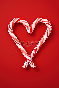 甜甘蔗背景图片_红色背景上拼出一颗带有拐杖糖的心