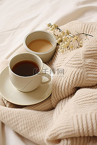 毯子背景图片_一杯带手套的咖啡，上面铺着柔软的毛毯