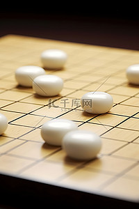 一种围棋游戏，将大的白色方块放在小木块的顶部