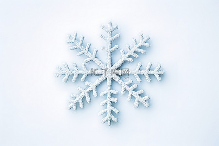 雪花小装饰背景图片_白色背景中制作的装饰小雪花