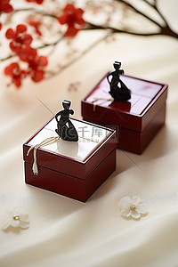 长方形背景图片_展示了两个长方形的日本雕像盒子