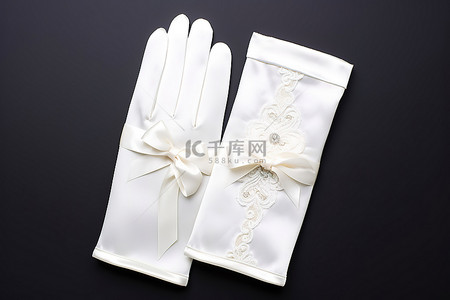 白色缎面背景图片_带丝带的白色缎面婚礼手套