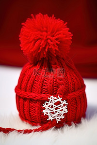 温暖治愈爱心背景图片_带帽子的红色红色毛线球