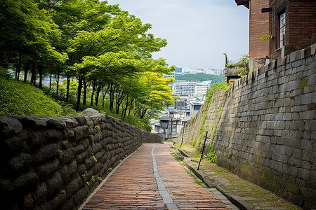 城堡城堡背景图片_通往砖墙的楼梯的铺砌道路