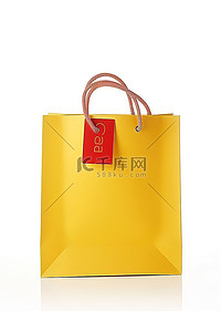 购物袋黄色背景图片_一个带有标签的黄色购物袋