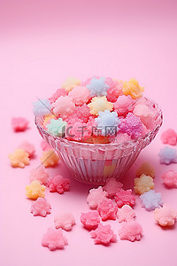 彩色糖果背景图片_粉红色的桌子上摆着粉红色的花，里面装满了柔和的彩色糖果