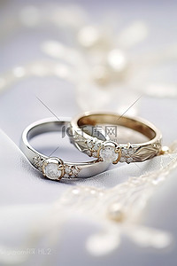 两个戒指背景图片_白色蕾丝上的两个结婚戒指