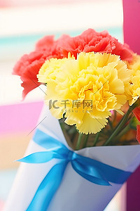 蓝色礼盒背景图片_蓝色礼盒中的黄色康乃馨花