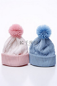 粉色的帽子背景图片_两顶粉色和蓝色针织无檐便帽