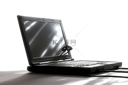 科技互联网背景图片_侧面放着一台笔记本电脑，上面有一根魔杖