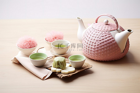 综艺包装花字背景图片_茶壶杯子和饼干，旁边是一片茶