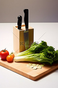 木板上的一把刀和蔬菜