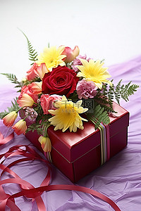 紫色和黄色的花朵放在红色盒子里并绑在一起