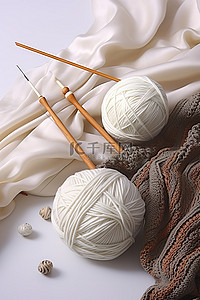 白色的纱线针织球和织针