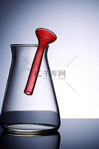 带吸管背景图片_带红色手柄瓶子的玻璃烧杯