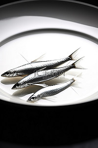 盘子里放三个小沙丁鱼