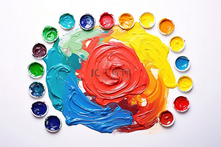 彩色刷子背景图片_一个调色板，上面有彩色颜料和一把画笔