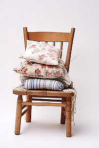 枕头上背景图片_白色背景上的一把带枕头的小木椅