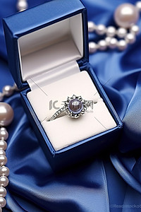 戒指戒指背景图片_盒子里装着珍珠戒指，里面有珠子