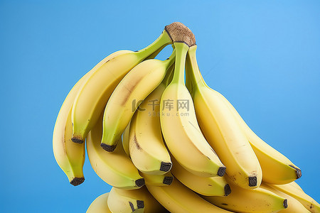 福利蓝色背景图片_蓝色背景中的香蕉堆成一堆