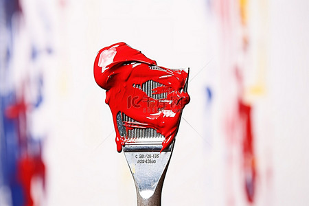 刀架背景图片_一个画罐架，上面挂着一支红色画笔