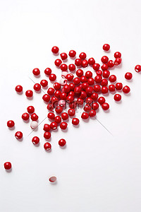一圈粒子背景图片_白色上放置一颗大形状的红色珠子