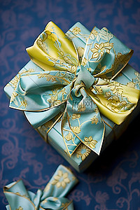 新年包装背景图片_蓝色包装中的小樱花蝴蝶结礼物
