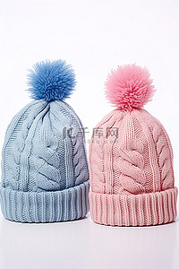 粉色的帽子背景图片_两顶粉色和蓝色针织无檐便帽
