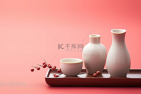 大集背景图片_红色背景中的两杯茶和一瓶