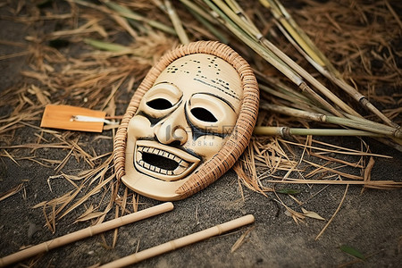 竹文化背景图片_一些竹棍旁边有一个木制面具