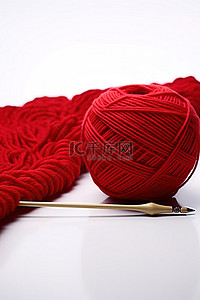 红色针织背景图片_一些木织针旁边的红色毛线球