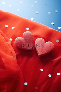 两颗红心背景图片_红盒子前有两颗红心，上面有礼物