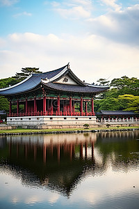 楼亭背景图片_韩国的一座宫殿，周围环绕着水域和树木