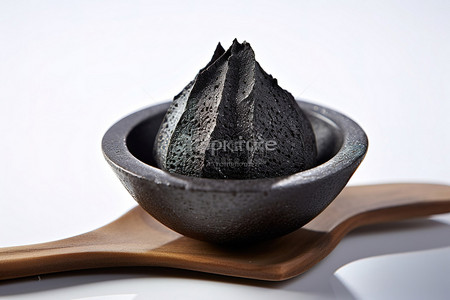 煤背景图片_一勺黑煤放在碗里，放在莲花上