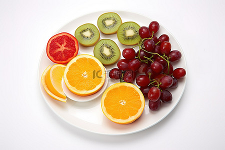 健康的水果背景图片_一盘五颜六色的水果猕猴桃和橙子