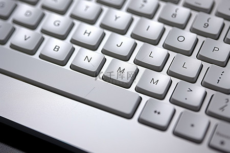 键盘电脑背景图片_由灰色材料制成的电脑键盘