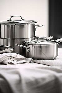 不锈钢炊具背景图片_该系列不锈钢炊具放置在厨房的台面上