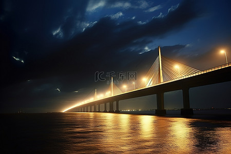 海洋旅行背景图片_一座桥在灯火通明的情况下越过海洋