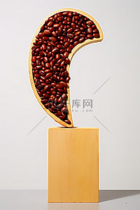 咖啡豆红色背景图片_标志形状的红色咖啡豆