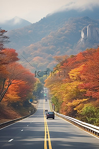 路上的风景背景图片_首尔路上的秋天风景和山脉