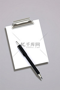 回形针背景图片_带有笔和回形针的文档